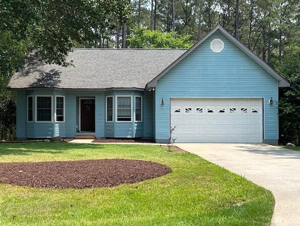 159 Rhett Dr, Mccormick, SC 29835 - ranch-style house featuring driveway, an attached garage, a front yard, and roof with shingles