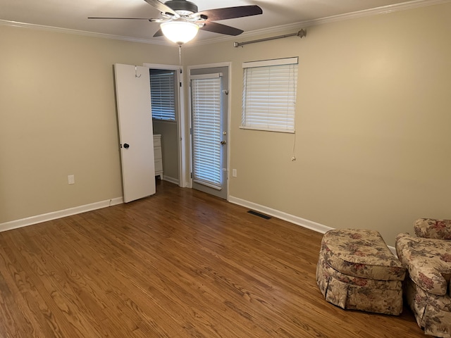 410 Johns Rd, Thomson, GA 30824 - bedroom featuring crown molding, baseboards, wood finished floors, and ceiling fan