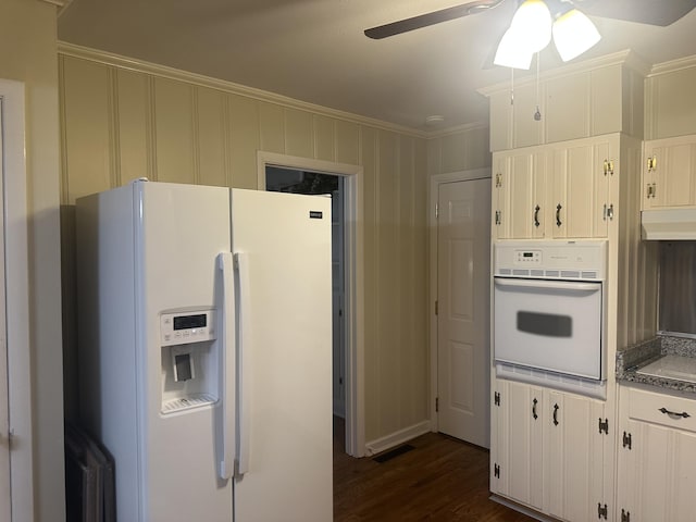 410 Johns Rd, Thomson, GA 30824 - kitchen featuring white appliances, dark wood finished floors, a ceiling fan, ornamental molding, and white cabinets