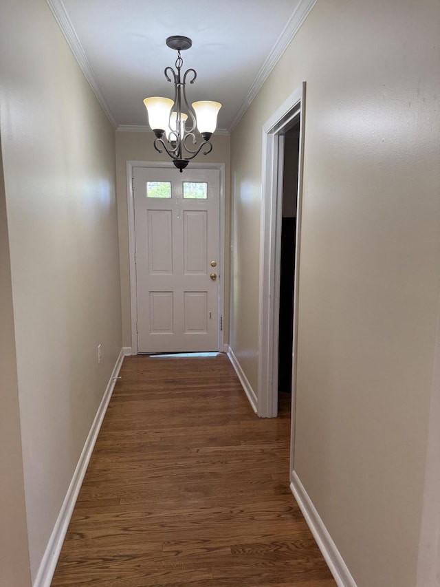 410 Johns Rd, Thomson, GA 30824 - entryway with dark wood-style floors, ornamental molding, a chandelier, and baseboards