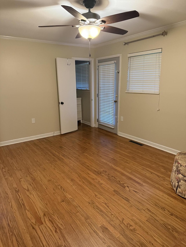 410 Johns Rd, Thomson, GA 30824 - spare room featuring ceiling fan, crown molding, wood finished floors, and baseboards