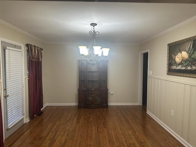410 Johns Rd, Thomson, GA 30824 - unfurnished dining area featuring a chandelier, dark wood-style floors, crown molding, and baseboards