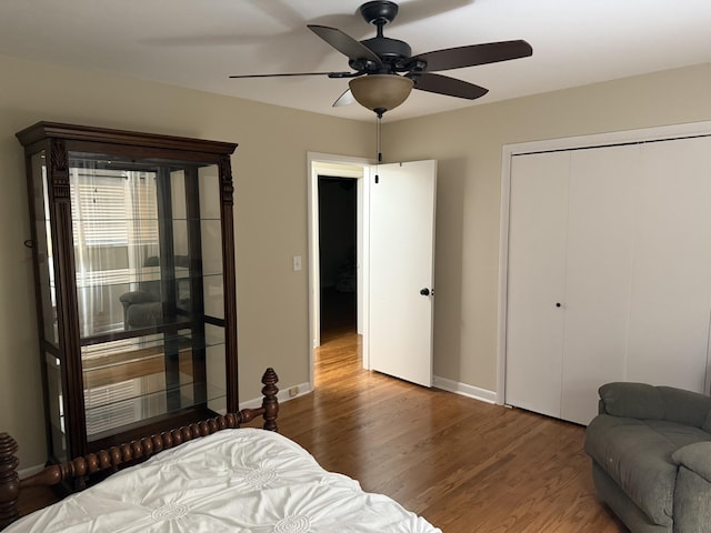 410 Johns Rd, Thomson, GA 30824 - bedroom with wood finished floors, a closet, baseboards, and ceiling fan
