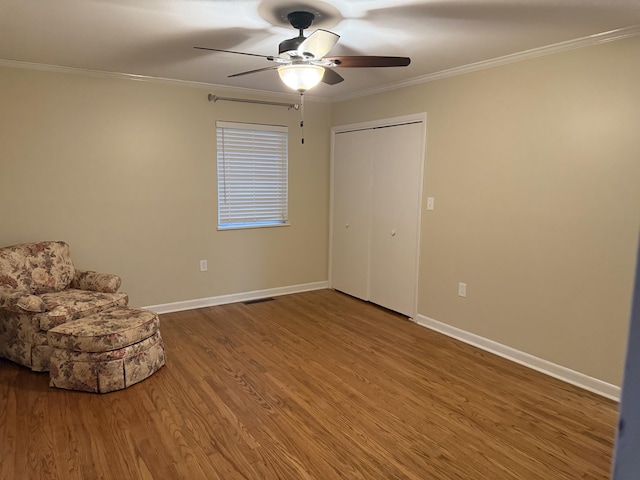410 Johns Rd, Thomson, GA 30824 - unfurnished room featuring wood finished floors, a ceiling fan, ornamental molding, and baseboards