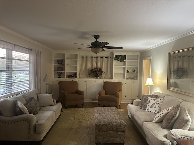410 Johns Rd, Thomson, GA 30824 - living room featuring a ceiling fan, ornamental molding, wood finished floors, and built in shelves