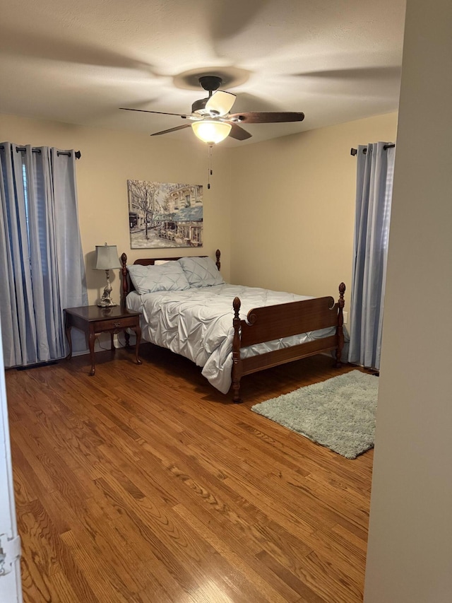 410 Johns Rd, Thomson, GA 30824 - bedroom with wood finished floors and a ceiling fan