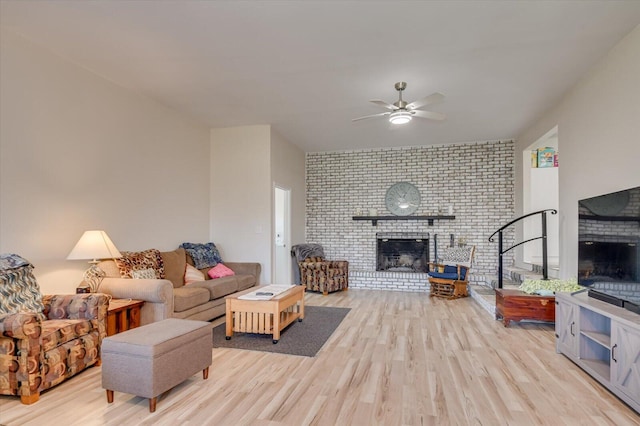 2107 Brown Rd, Hephzibah, GA 30815 - living room featuring wood finished floors, a brick fireplace, and a ceiling fan