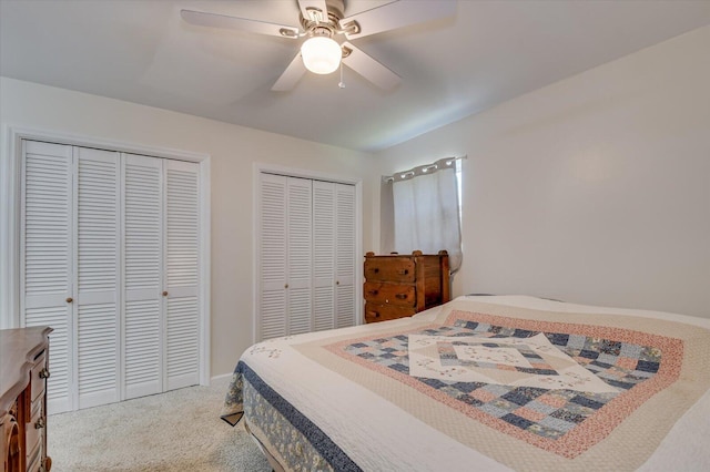 2107 Brown Rd, Hephzibah, GA 30815 - bedroom featuring light carpet, two closets, and a ceiling fan