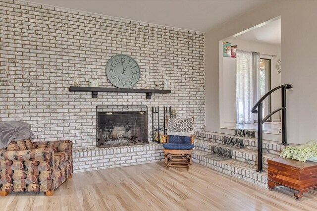 2107 Brown Rd, Hephzibah, GA 30815 - living area featuring a brick fireplace and wood finished floors