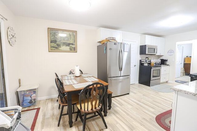 dining area featuring light hardwood / wood-style floors