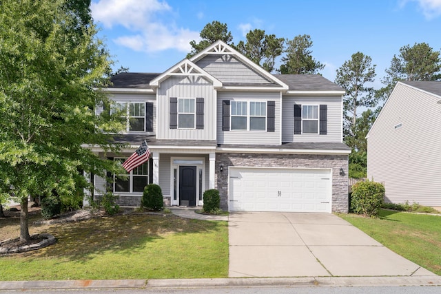 501 Cranberry Cir, Grovetown, GA 30813 - craftsman-style home featuring a garage, a front yard, driveway, and stone siding