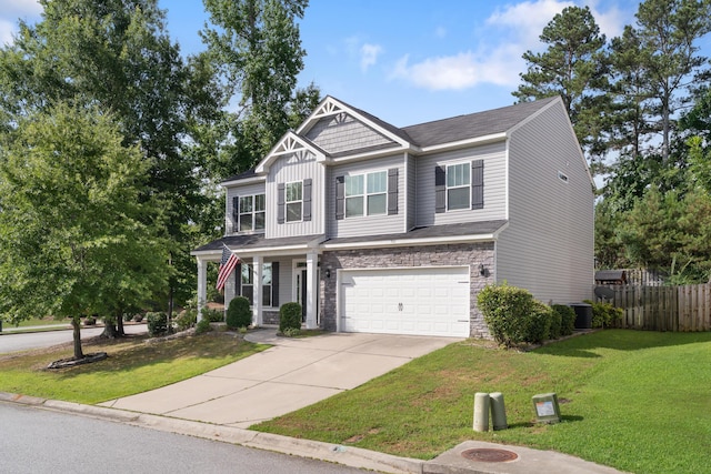 501 Cranberry Cir, Grovetown, GA 30813 - craftsman house with driveway, a garage, stone siding, and covered porch