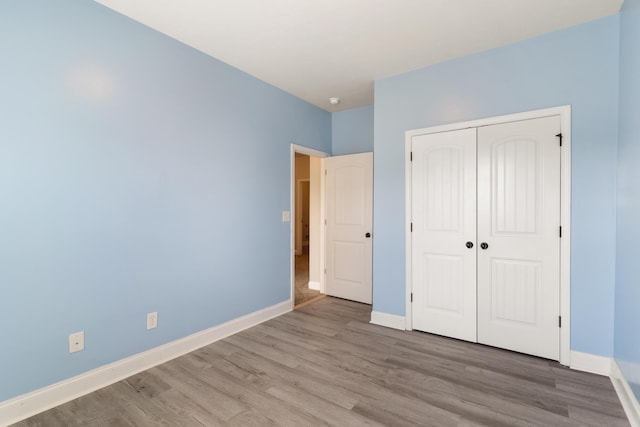 501 Cranberry Cir, Grovetown, GA 30813 - unfurnished bedroom featuring wood finished floors and a closet