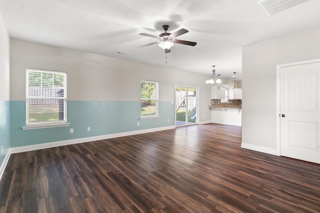 501 Cranberry Cir, Grovetown, GA 30813 - unfurnished living room featuring ceiling fan, dark wood-type flooring, and a chandelier