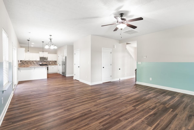 501 Cranberry Cir, Grovetown, GA 30813 - unfurnished living room with ceiling fan, dark wood finished floors, and a chandelier