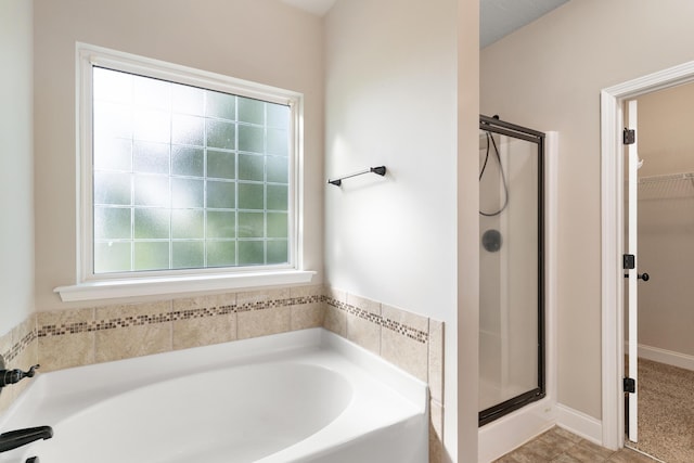 501 Cranberry Cir, Grovetown, GA 30813 - bathroom with a bath, a shower stall, and a walk in closet