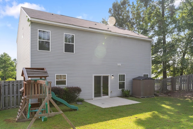 501 Cranberry Cir, Grovetown, GA 30813 - rear view of property with a storage unit, a playground, a patio, and a fenced backyard