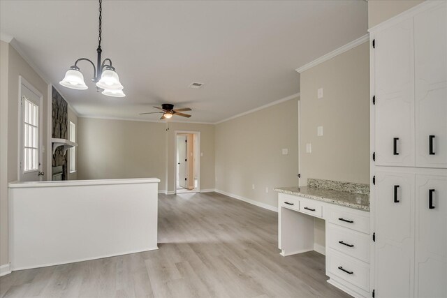 2669 Corning St, Hephzibah, GA 30815 - kitchen with light wood finished floors, a ceiling fan, baseboards, white cabinetry, and crown molding