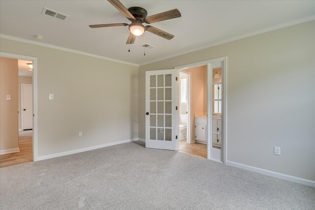 2669 Corning St, Hephzibah, GA 30815 - unfurnished bedroom featuring light colored carpet, french doors, ornamental molding, baseboards, and ensuite bathroom