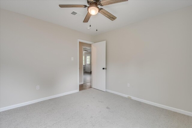 2669 Corning St, Hephzibah, GA 30815 - empty room featuring light carpet, baseboards, and ceiling fan