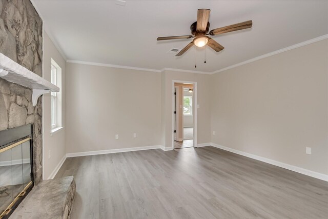 2669 Corning St, Hephzibah, GA 30815 - unfurnished living room featuring wood finished floors, ornamental molding, ceiling fan, a fireplace, and baseboards