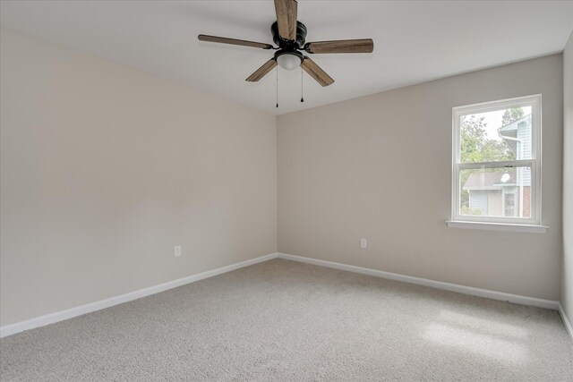 2669 Corning St, Hephzibah, GA 30815 - spare room with carpet floors, baseboards, and a ceiling fan