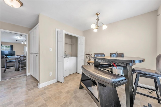 607 Beretta Dr, Grovetown, GA 30813 - dining area featuring washer and dryer and a chandelier