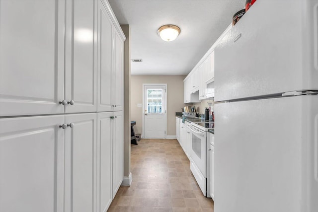 607 Beretta Dr, Grovetown, GA 30813 - kitchen featuring white appliances and white cabinetry