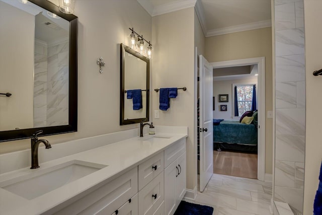 bathroom with crown molding and vanity