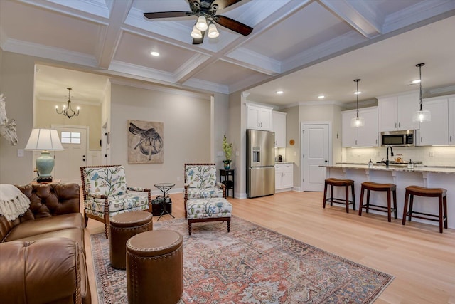 living room featuring beam ceiling, light hardwood / wood-style floors, and coffered ceiling