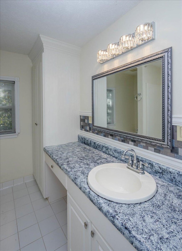 bathroom with tile patterned flooring and vanity