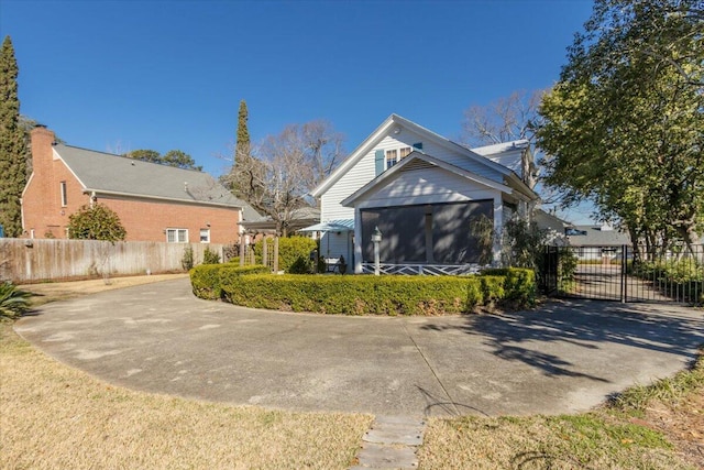 view of front of house with a sunroom and fence