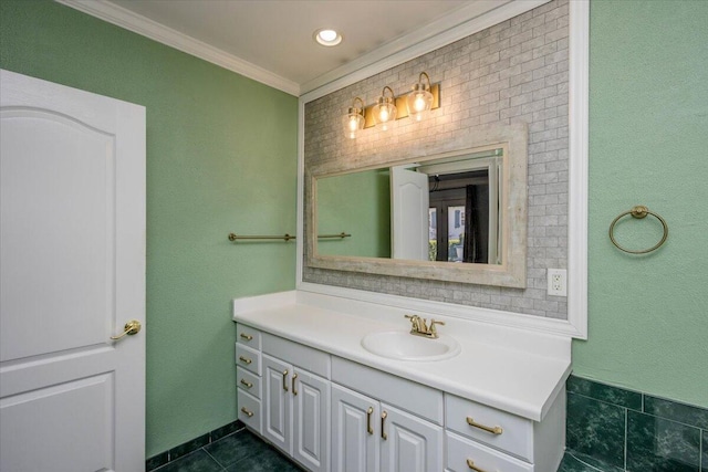 bathroom with ornamental molding, tile patterned flooring, and vanity