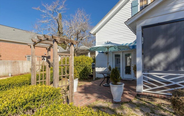 view of patio / terrace featuring fence