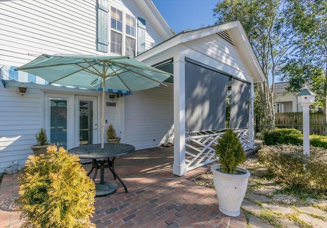 view of patio featuring fence