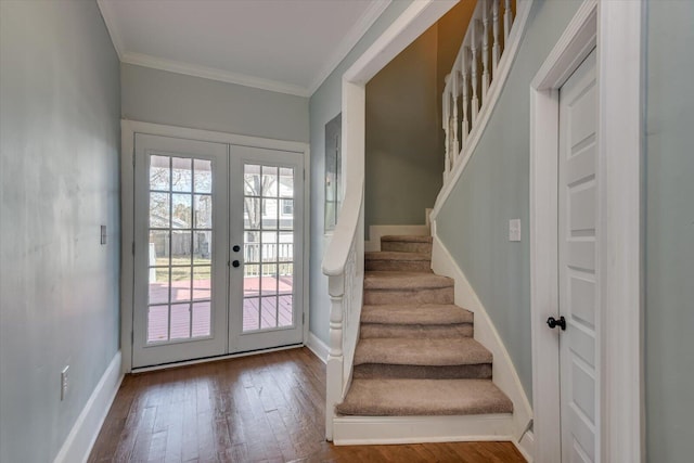 doorway to outside featuring wood-type flooring, ornamental molding, and french doors