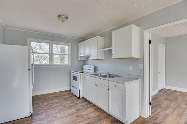 kitchen featuring crown molding, white cabinetry, sink, and white appliances