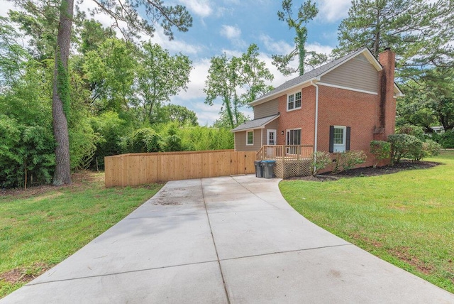 2421 Castlewood Dr, Augusta, GA 30904 - view of side of home featuring brick siding, a chimney, and a wooden deck