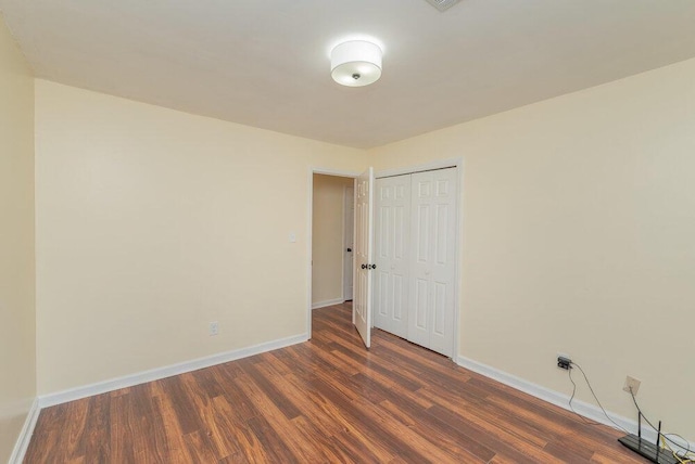 2421 Castlewood Dr, Augusta, GA 30904 - spare room featuring dark wood-type flooring and baseboards