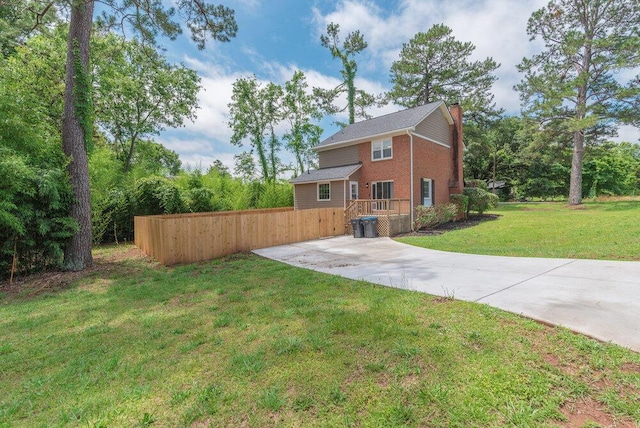 2421 Castlewood Dr, Augusta, GA 30904 - back of house featuring a chimney, brick siding, and concrete driveway