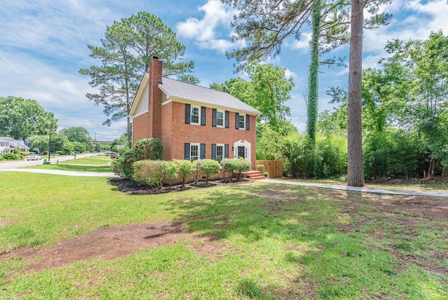 2421 Castlewood Dr, Augusta, GA 30904 - colonial home with a chimney, a front yard, and brick siding
