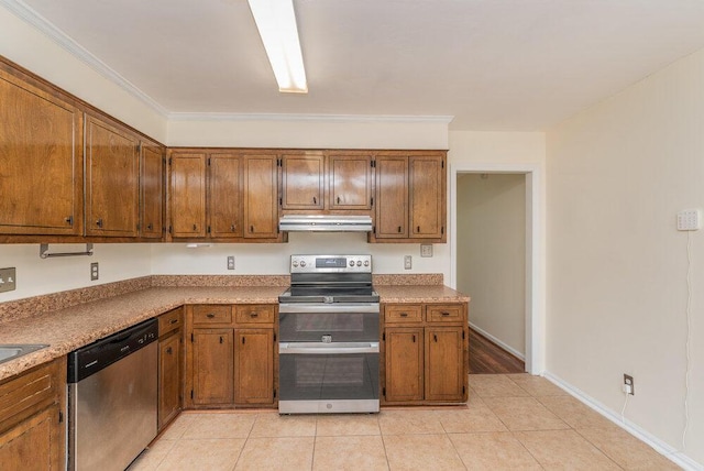 2421 Castlewood Dr, Augusta, GA 30904 - kitchen featuring appliances with stainless steel finishes, under cabinet range hood, brown cabinetry, and light tile patterned floors
