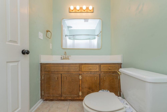 2421 Castlewood Dr, Augusta, GA 30904 - bathroom with toilet, vanity, tile patterned floors, and baseboards