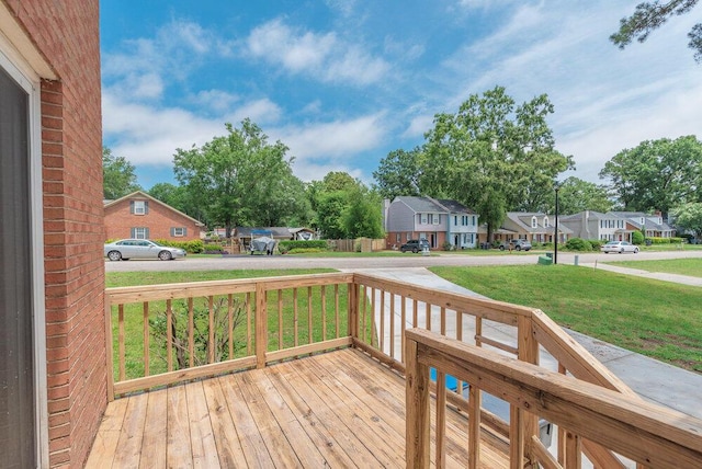 2421 Castlewood Dr, Augusta, GA 30904 - wooden porch featuring a residential view and a lawn