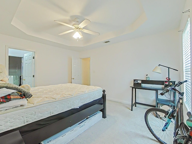 15 Whitney Ct, Augusta, GA 30904 - bedroom with a tray ceiling, light colored carpet, baseboards, and a ceiling fan