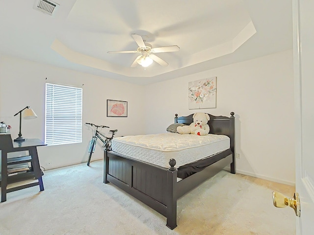 15 Whitney Ct, Augusta, GA 30904 - bedroom featuring a tray ceiling, light colored carpet, ceiling fan, and baseboards