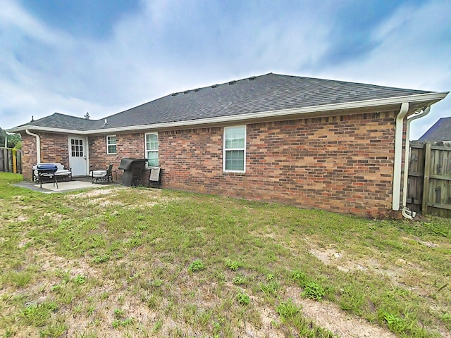 15 Whitney Ct, Augusta, GA 30904 - back of property featuring a patio area, roof with shingles, and brick siding