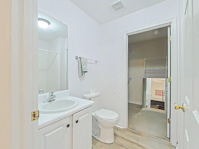 15 Whitney Ct, Augusta, GA 30904 - full bathroom with vanity, toilet, wood finished floors, and a shower