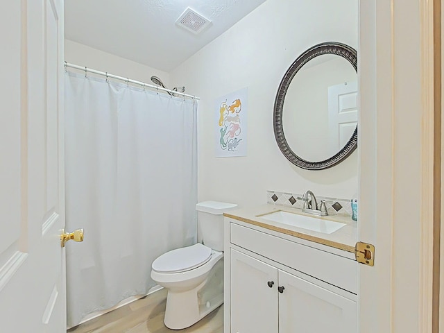 15 Whitney Ct, Augusta, GA 30904 - bathroom featuring vanity, toilet, curtained shower, and wood finished floors
