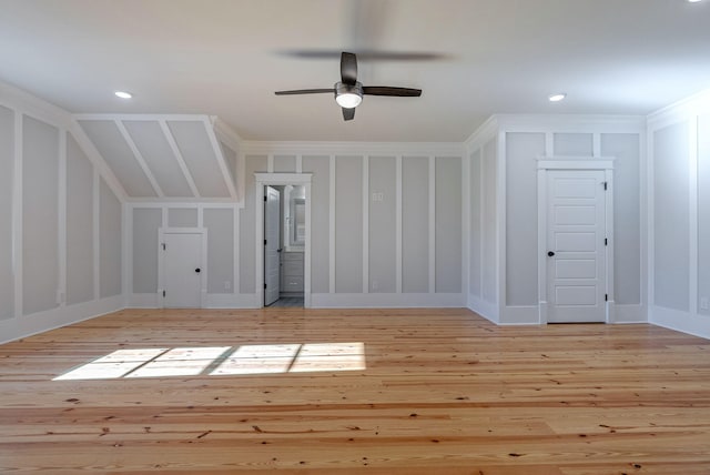 bonus room with light hardwood / wood-style flooring and ceiling fan